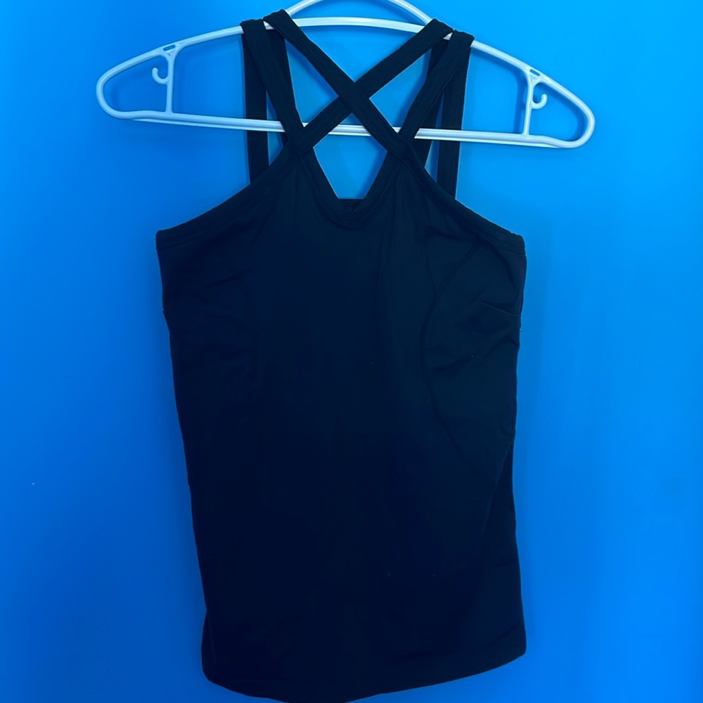 Kira Grace caged halter tank. Black size M. Excellent condition. Built in bra